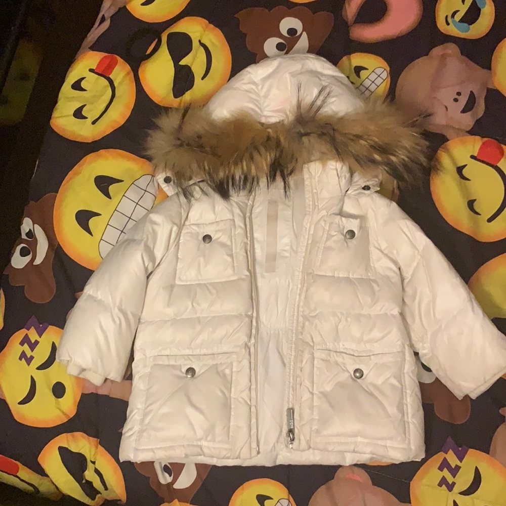 Worn baby girls add down coat. Slight pinkish stains on back and hood
